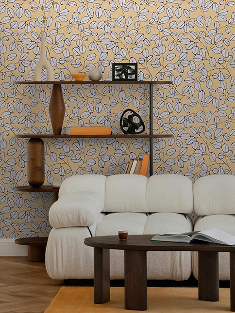 Yellow patterned wallpaper with leaf tendrils